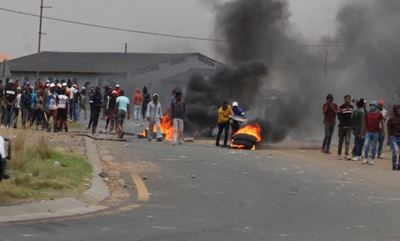 Children run for safety as protesters set alight tyres near school in Ermelo