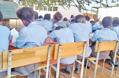 Pupils at Musina school write exams under trees