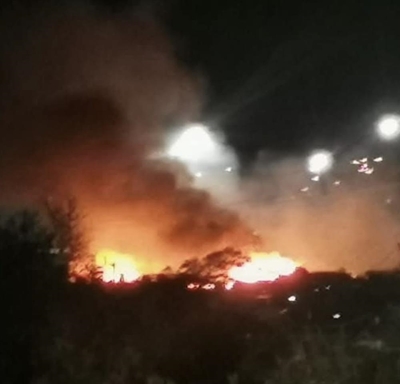 Calling for support after destruction of over 100 structures in fires