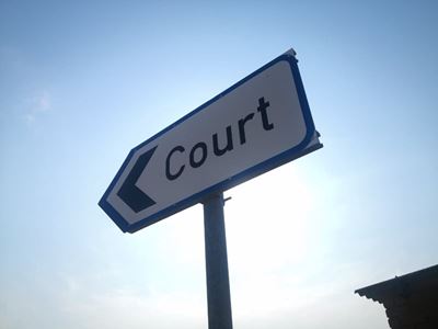 Diaz Hotel defrauded, woman in court