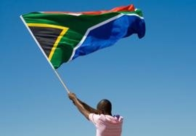 Minister condemns burning of SA flag in advert