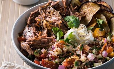 Slow-cooked, pull-apart fragrant lamb with quinoa, herb and tomato salad