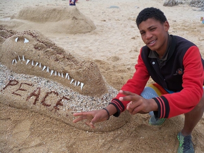 Boy builds sand sculptures to finish school