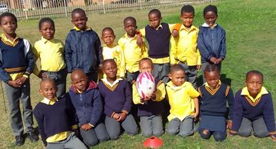 Imekhaya learners being coached in rugby basics