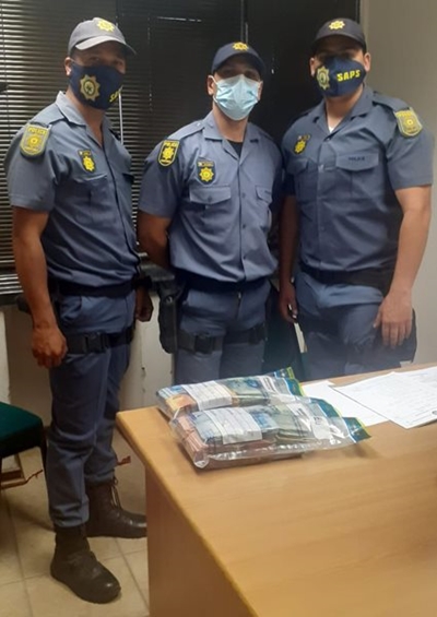 Men arrested after police find bundles of cash at accident scene