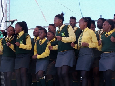Local school choir performs at Port stage