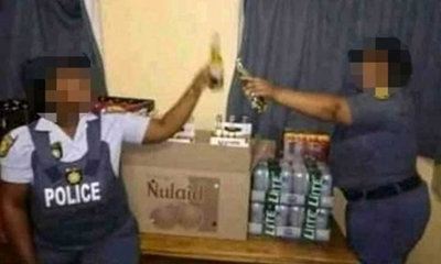 SAPS to investigate picture of officers posing with alcohol