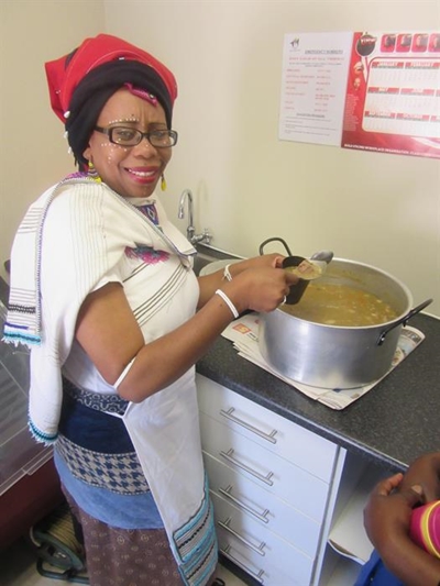 Local lady serves with a smile