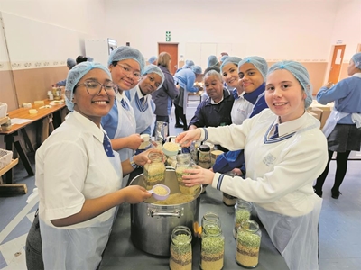 York High Interact Club's learners pack meals for those in need