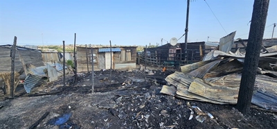One person dead, 17 homes destroyed in fire
