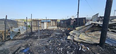 One person dead, 17 homes destroyed in fire