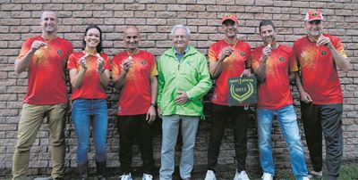 Knysna Marathon Club members proudly display Comrades medals