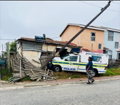 Police van crashes into lamppost, house