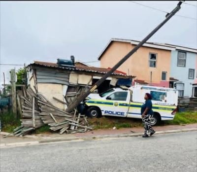 Police van crashes into lamppost, house