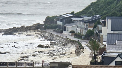 Victoria Bay escapes major damage after dramatic sea conditions, foam floods homes