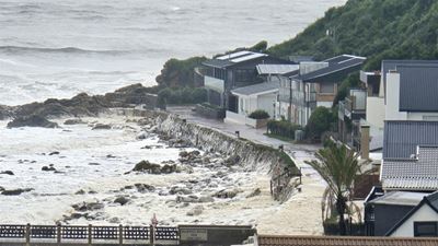 Victoria Bay escapes major damage after dramatic sea conditions, foam floods homes