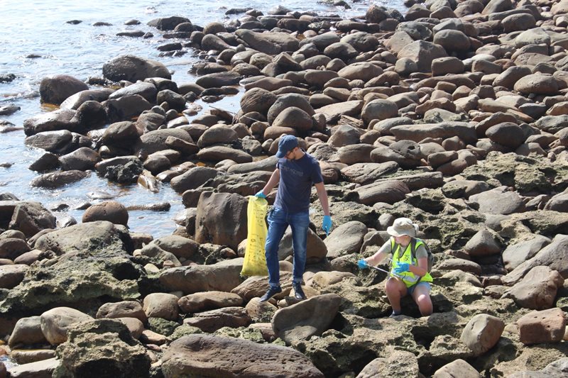 Locals get to work clearing beaches