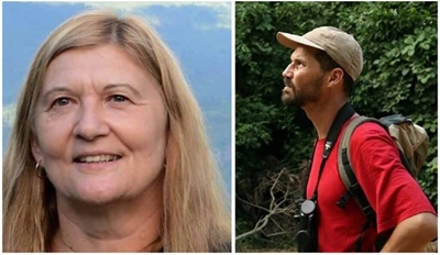 Police launch manhunt after academic and partner are found murdered 