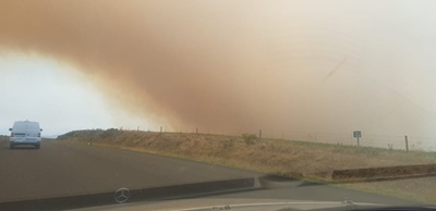 Firefighters battling two wildfires