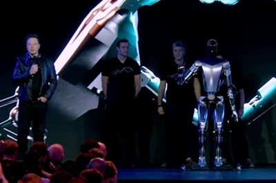 Tesla robot ‘Optimus’ waves as Musk plans to make millions