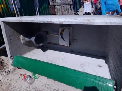 Toilet topples over, trapping woman inside