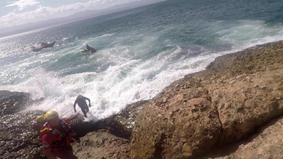 Daring sea rescue after hiker's injury