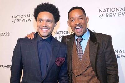 Trevor Noah opens up Grammy Awards with jab to Will Smith