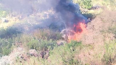 Heroes pull couple from burning car