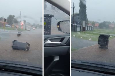 ‘Indicate, wena!’ – Driver dodges speeding dustbin on flooded street
