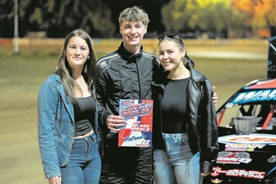 Teen hot rod racer fires it up on the oval track