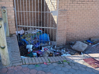 Taxi rank area dirty, litter-strewn