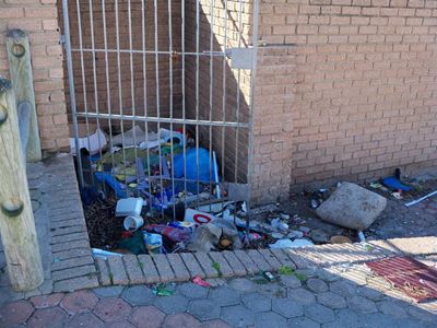 Taxi rank area dirty, litter-strewn