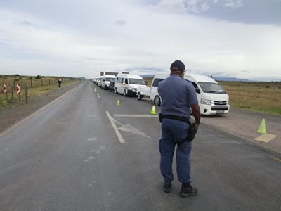 Taxis cut through farms to avoid roadblock 