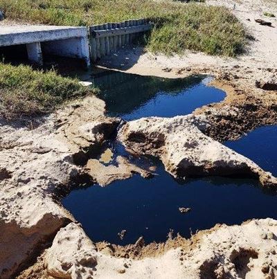Beach reopened after investigation into spill