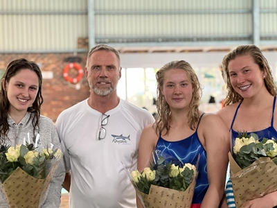 Swimmers score medals and trophies galore