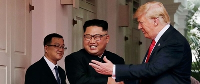 Tensions then smiles as Kim and Trump reach hands across history
