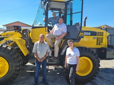 A brand-new machine grader truck for George
