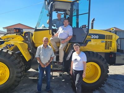 A brand-new machine grader truck for George