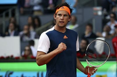 Thiem fights back for victory over Rublev