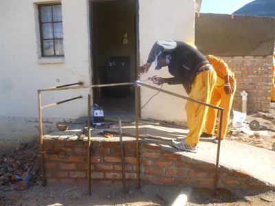Workers build ramp for local in wheelchair