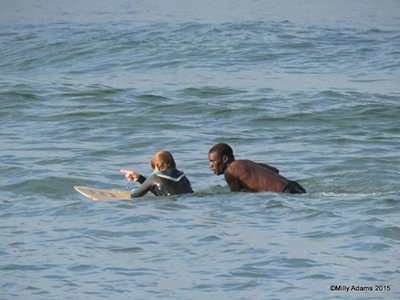 Teen surfer saves swimmer