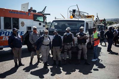 Chaos, the order of the day as angry residents ‘gun’ for police minister Cele