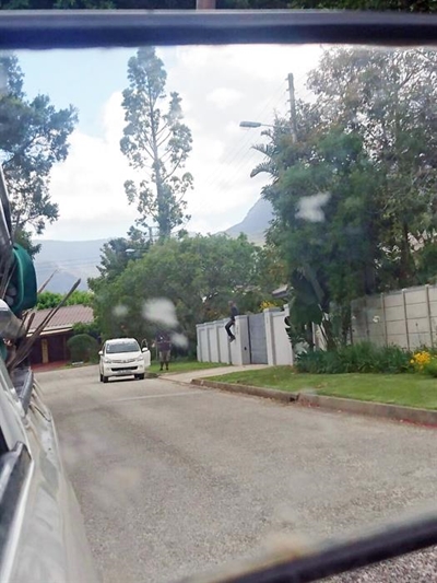 Meter readers scale home's wall