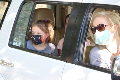 Learners see teachers at drive-through 