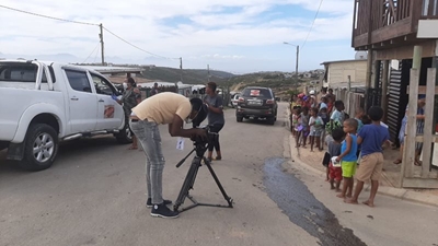 News crew take interest in community food drive