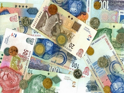 Rand eases as dollar edges up
