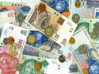 Rand eases as dollar edges up