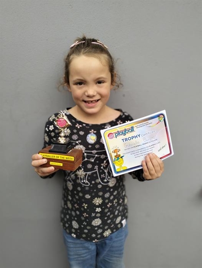 Gaby and Zeek boast playball trophies
