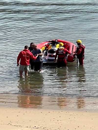 Fisherman safe after being swept off rocks