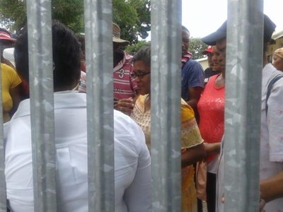 Desperate crowd gathers for food forms